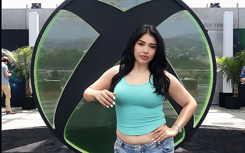 Creator posing in front of a giant Xbox logo