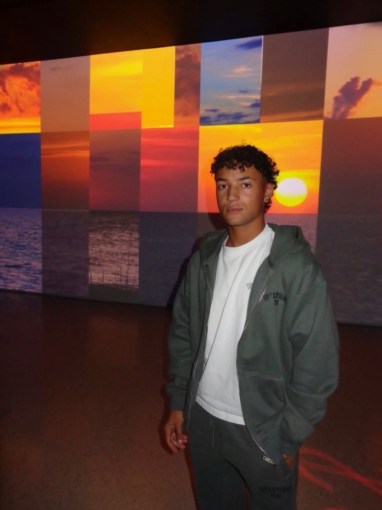 Creator portrait — sunset wall